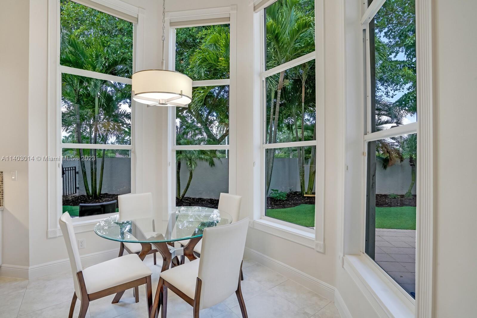3322 Northwest 53rd Circle Boca Raton, FL 33496 - Photo 12 of 45 a view of a chair and table in the balcony