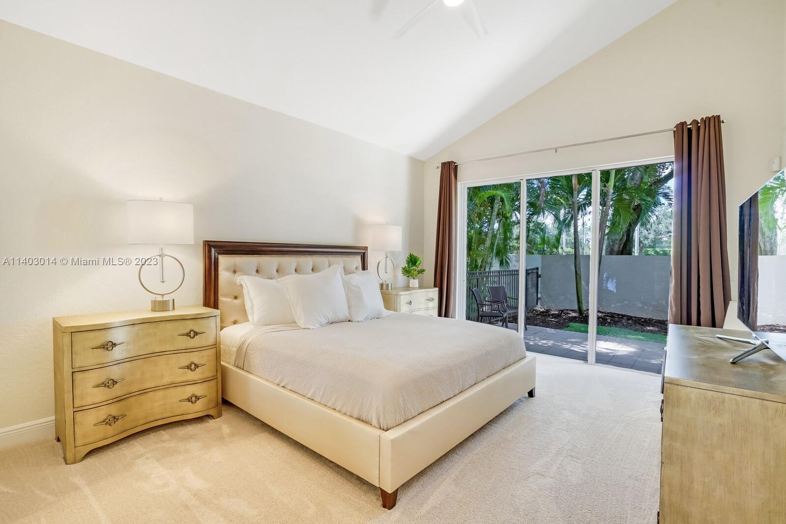 3322 Northwest 53rd Circle Boca Raton, FL 33496 - Photo 23 of 45 a bedroom with a bed and large window
