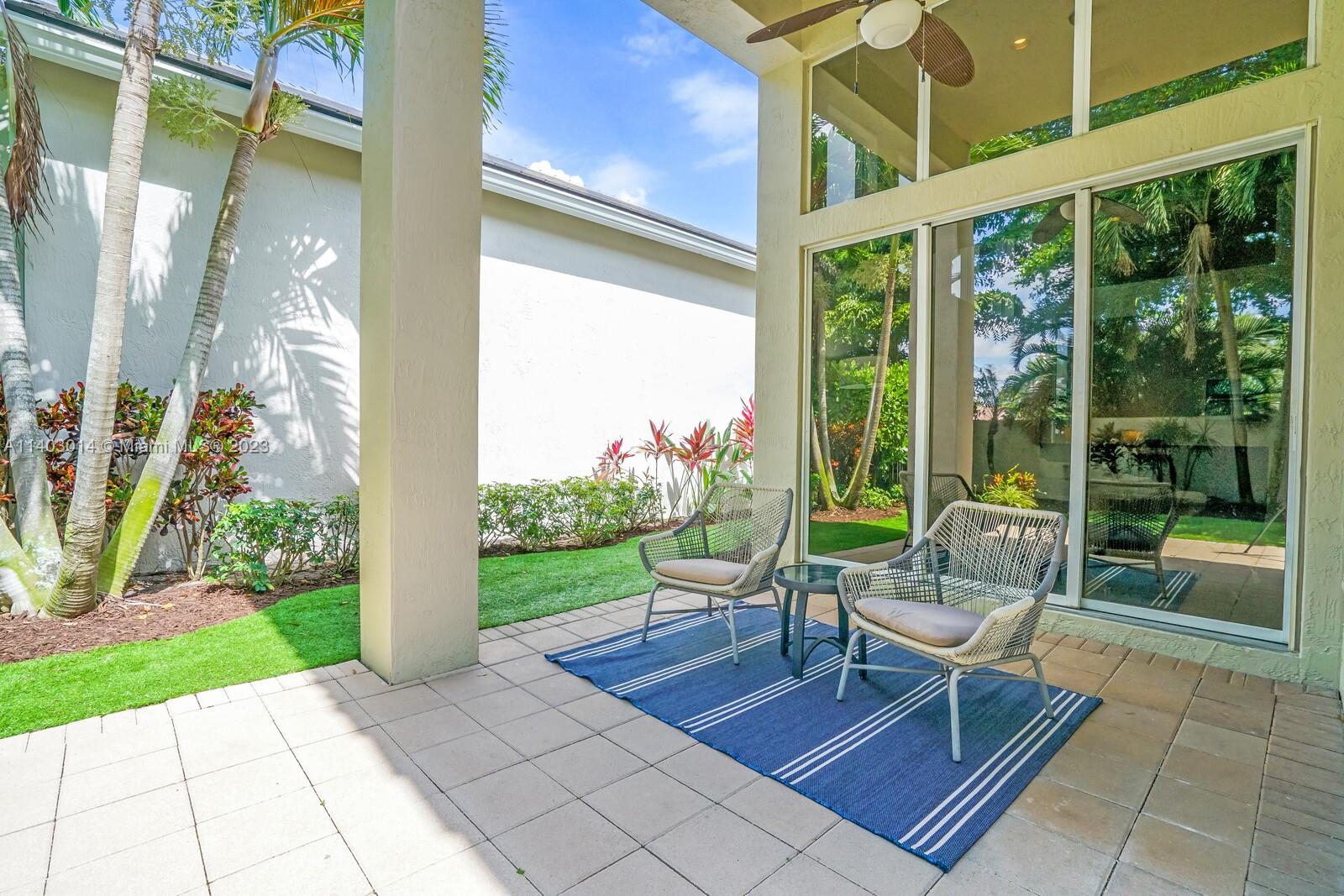 3322 Northwest 53rd Circle Boca Raton, FL 33496 - Photo 32 of 45 a house view with a sitting space and garden