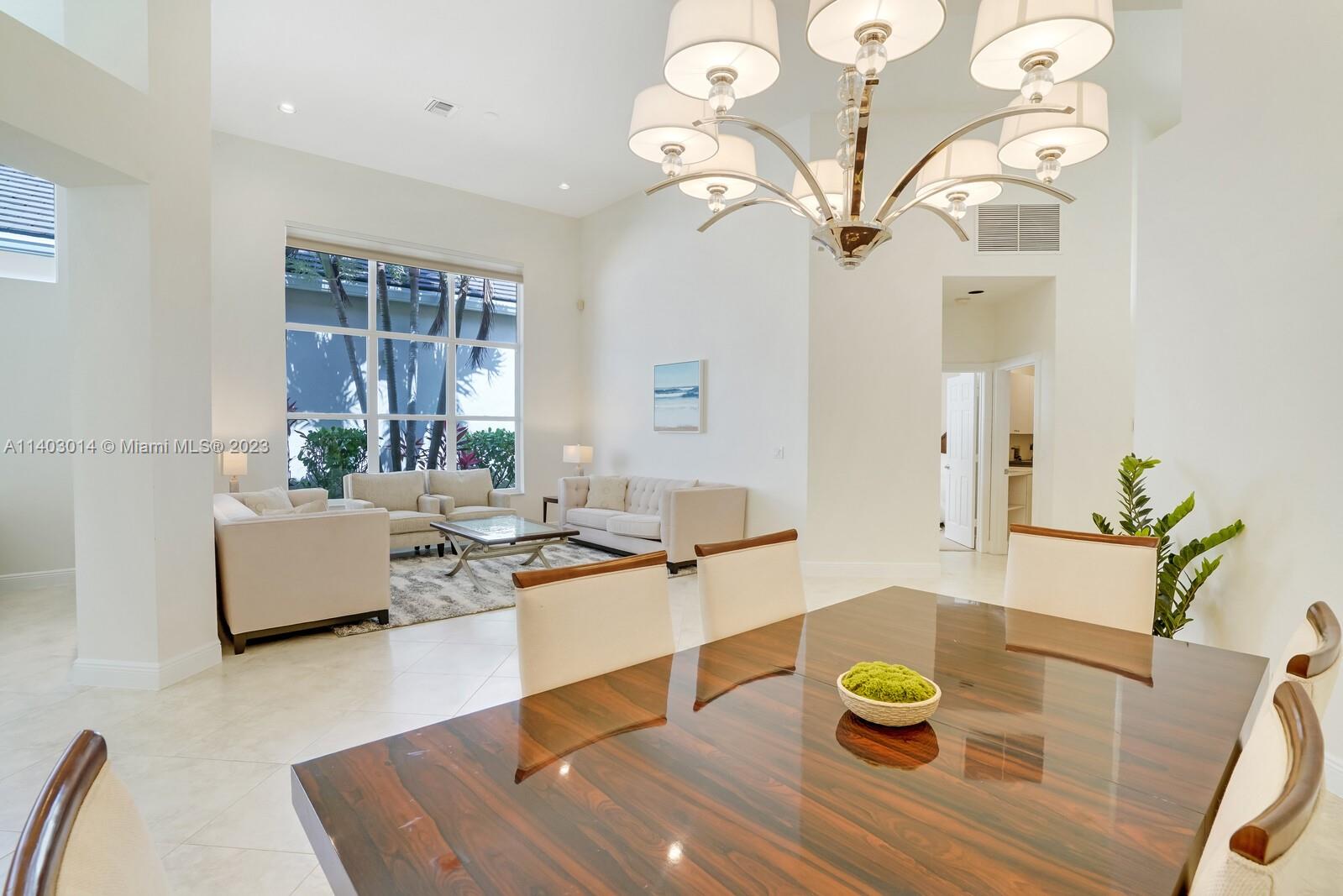 3322 Northwest 53rd Circle Boca Raton, FL 33496 - Photo 8 of 45 a living room with furniture and wooden floor