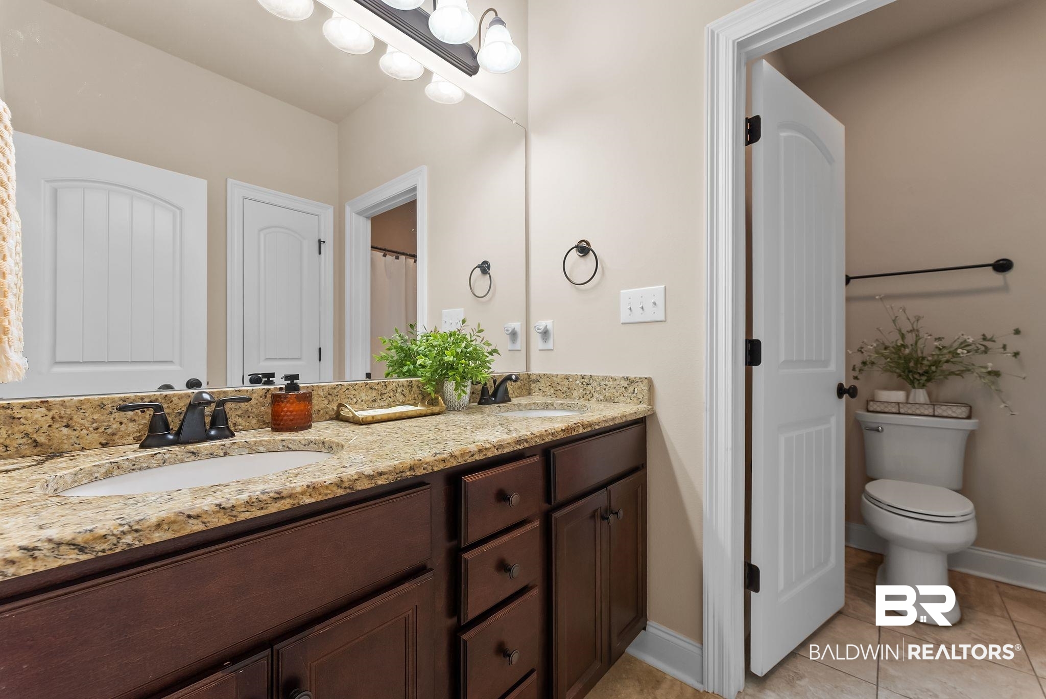 7015 Rocky Rd Loop Gulf Shores, AL 36542 - Photo 33 of 41 Bathroom featuring double vanity and light tile patterned flooring