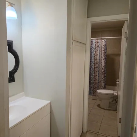 a bathroom with a sink and toilet