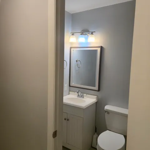 a bathroom with a glass shower door