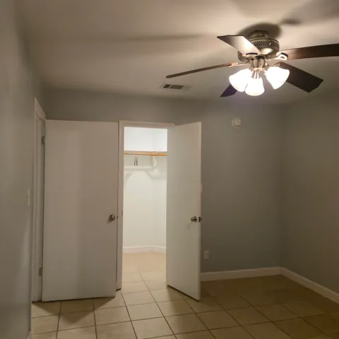 a view of an empty walk in closet