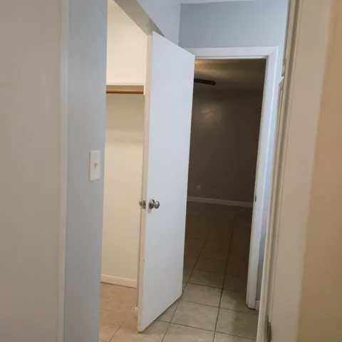 a white toilet and tub sitting next to a bathroom sink