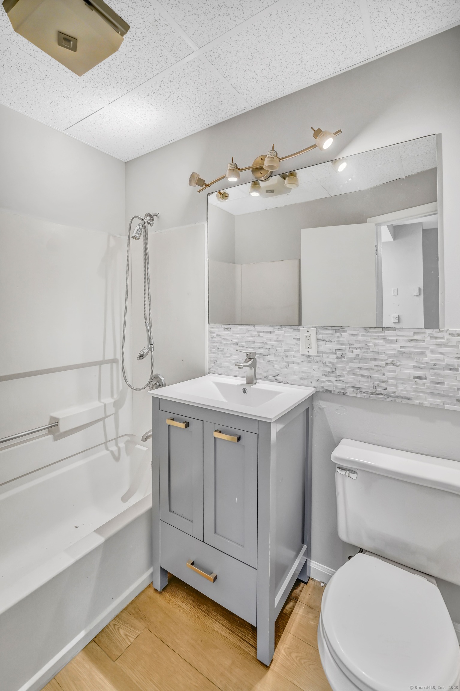 915 South Main Street Waterbury, CT 06706 - Photo 5 of 7 a bathroom with a sink a toilet and bathtub