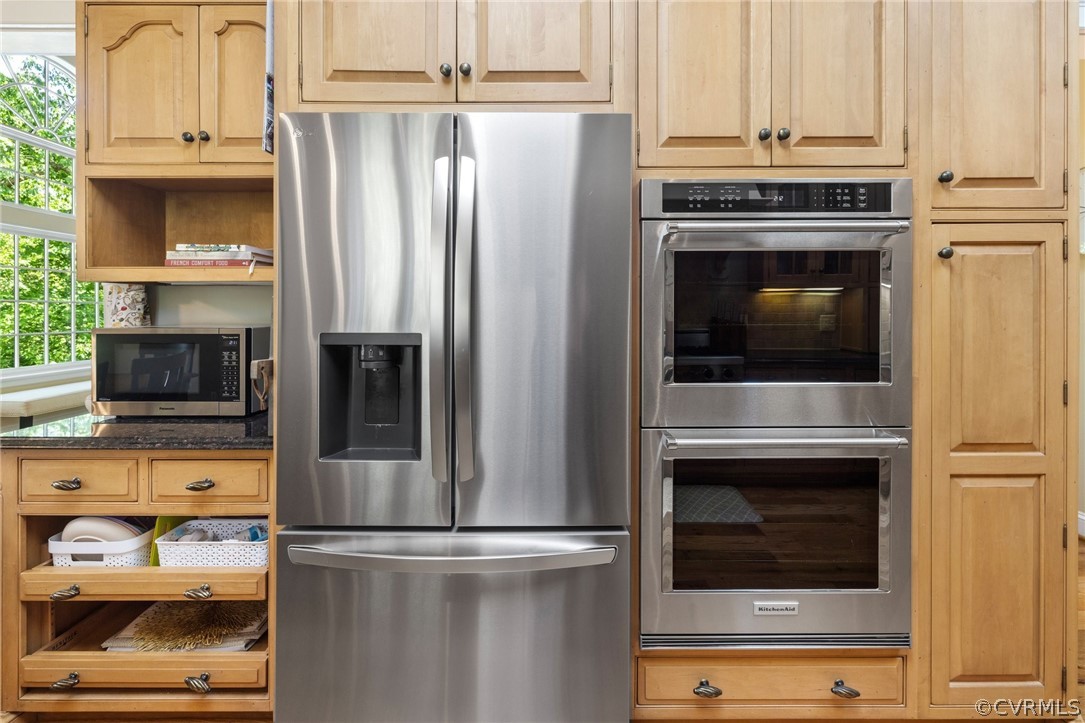 7215 Riverside Drive Richmond, VA 23225 - Photo 18 of 42 a kitchen with cabinets and stainless steel appliances