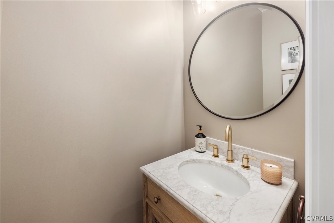7215 Riverside Drive Richmond, VA 23225 - Photo 19 of 42 a bathroom with a sink and a mirror