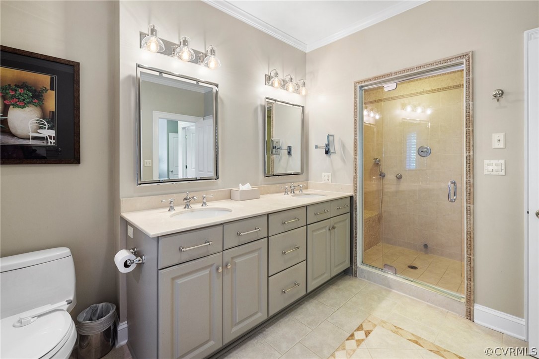 7215 Riverside Drive Richmond, VA 23225 - Photo 23 of 42 a bathroom with a double vanity sink toilet and shower