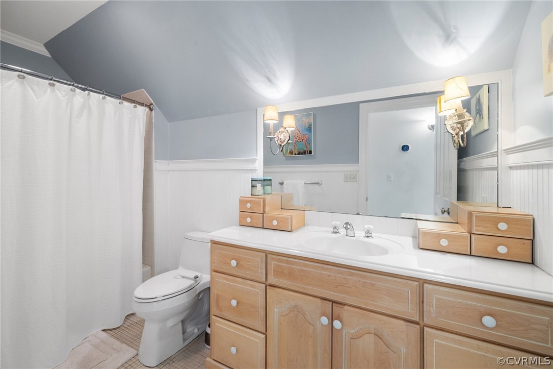 7215 Riverside Drive Richmond, VA 23225 - Photo 27 of 42 a bathroom with a granite countertop sink mirror vanity and toilet
