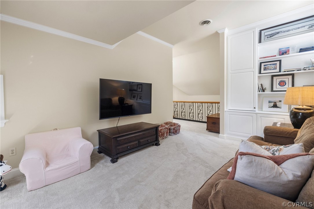 7215 Riverside Drive Richmond, VA 23225 - Photo 30 of 42 a living room with furniture and a flat screen tv