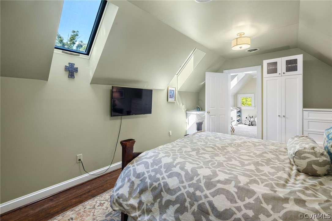 7215 Riverside Drive Richmond, VA 23225 - Photo 32 of 42 a bedroom with a bed and a flat screen tv