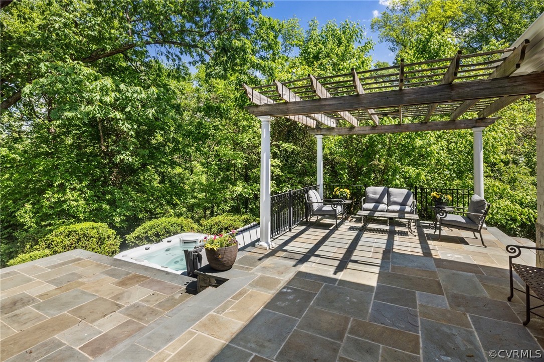 7215 Riverside Drive Richmond, VA 23225 - Photo 39 of 42 a view of a patio with table and chairs potted plants with wooden floor and fence