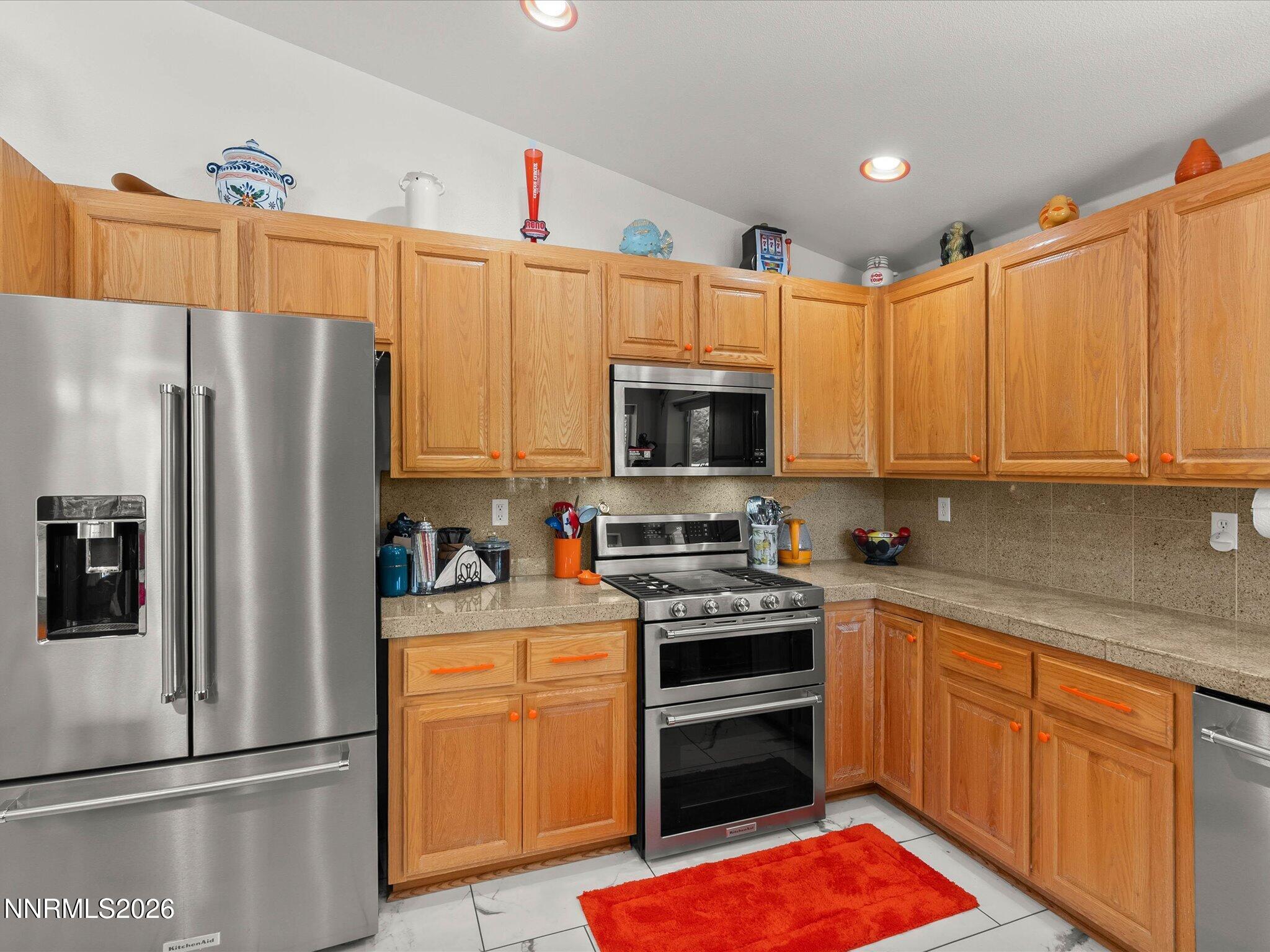 1080 Red Rock Road Fernley, NV 89408 - Photo 18 of 45 a kitchen with stainless steel appliances a refrigerator stove and microwave