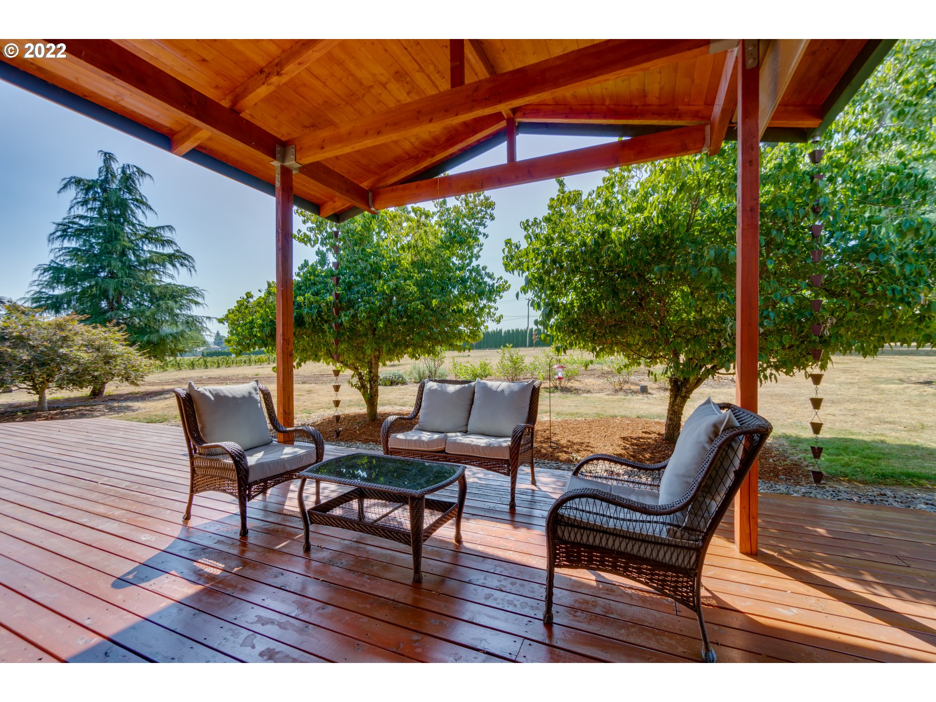 29089 Southeast Kelso Road Boring, OR 97009 - Photo 5 of 31 a view of a chairs and table in patio with a small yard