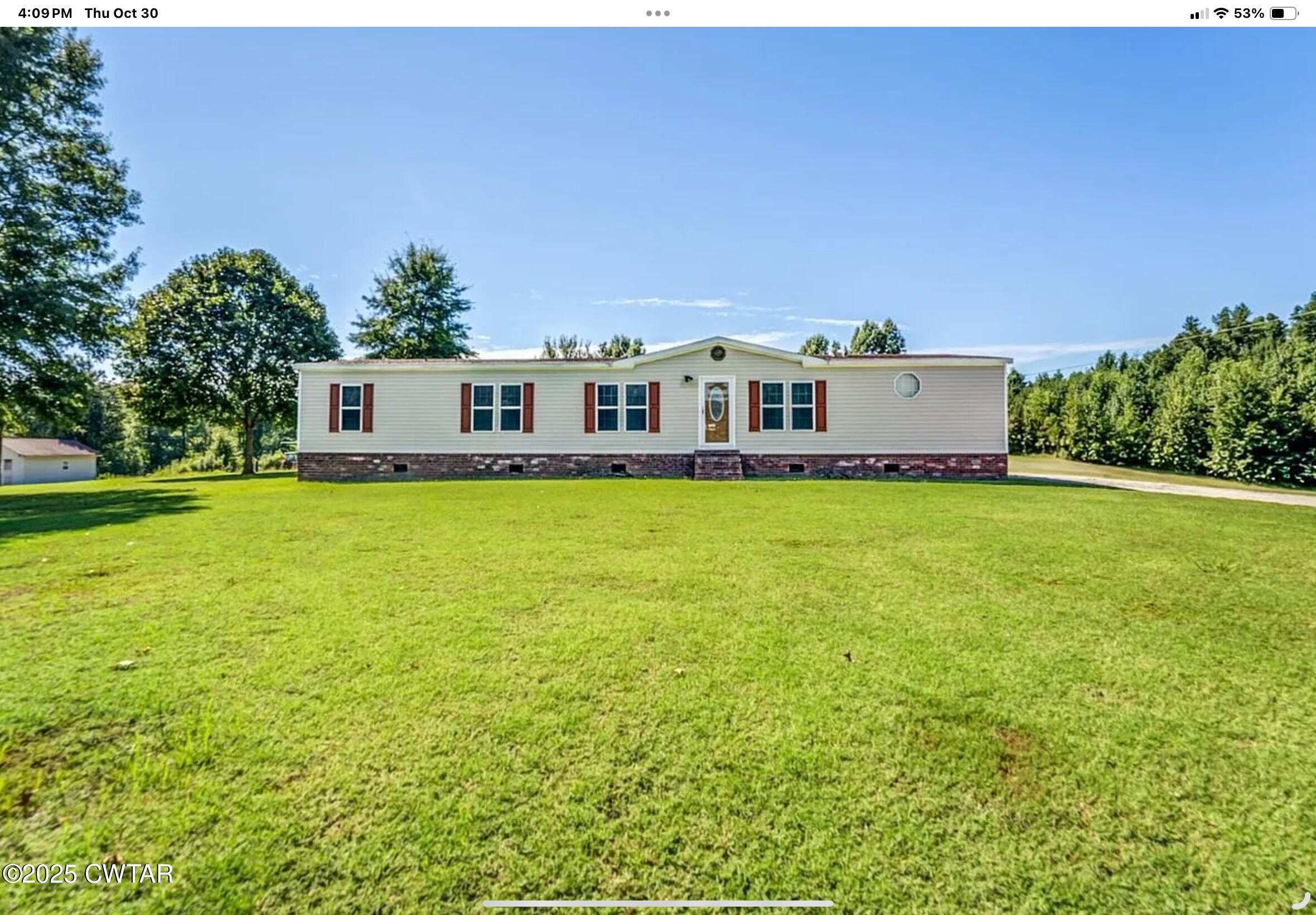a view of a house with a big yard