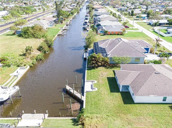 an aerial view of house with yard swimming pool and outdoor seating