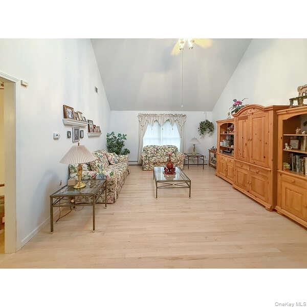 34 Feiertag Road Middletown, NY 10941 - Photo 11 of 28 Living room featuring light wood-style flooring and high vaulted ceiling