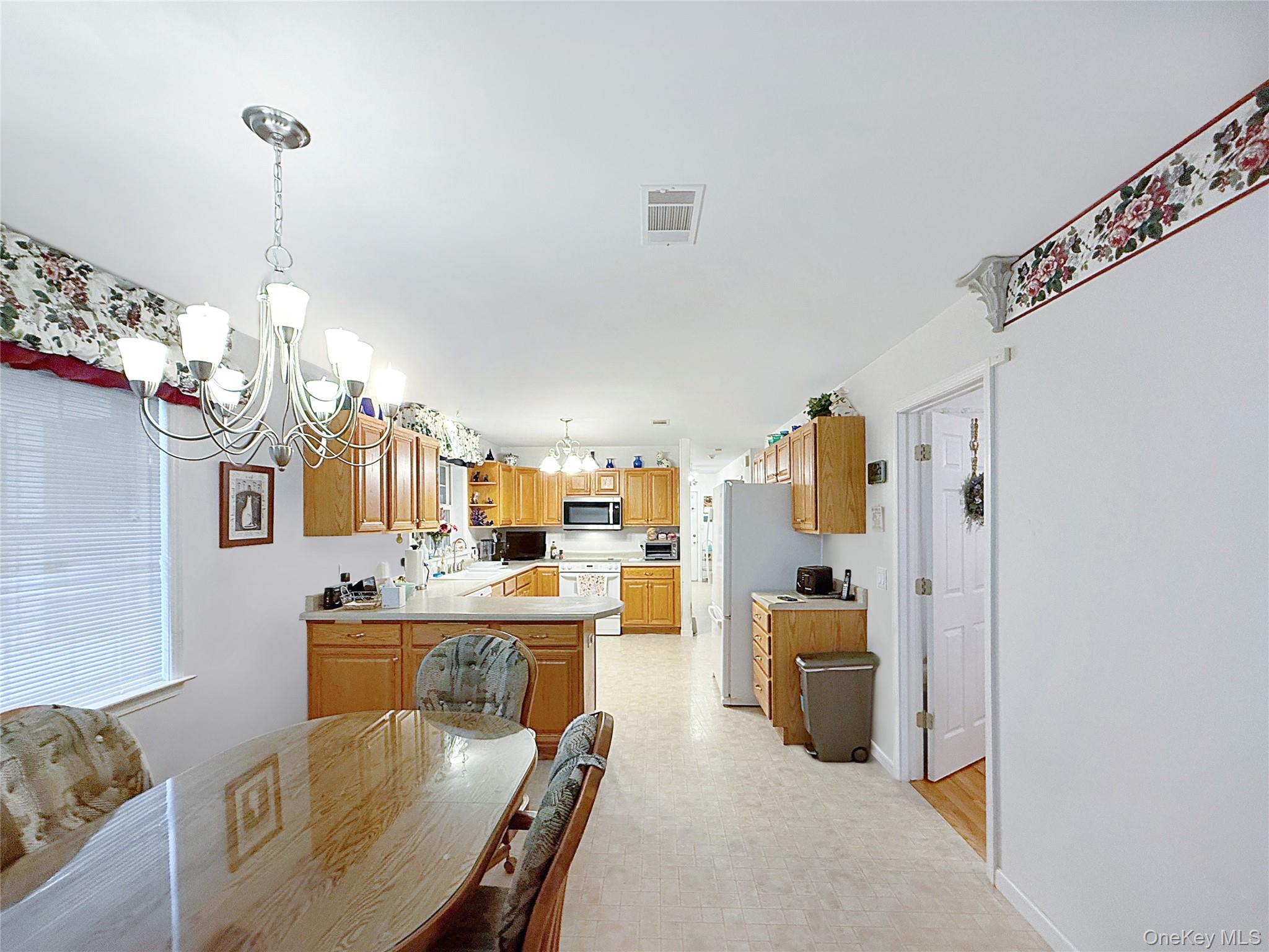 34 Feiertag Road Middletown, NY 10941 - Photo 13 of 28 Dining room featuring a chandelier and light floors