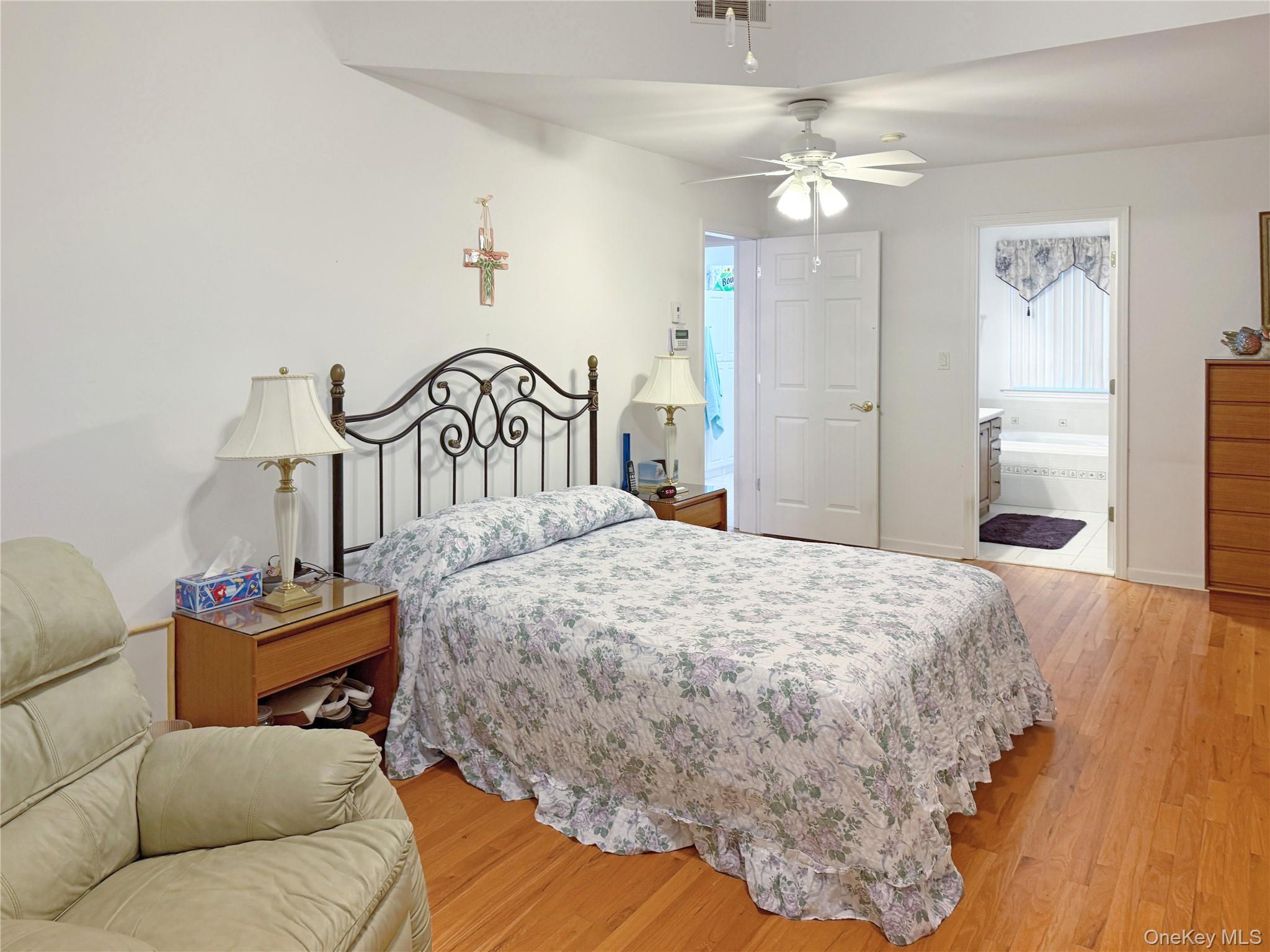 34 Feiertag Road Middletown, NY 10941 - Photo 20 of 28 Bedroom featuring light wood-style flooring, ceiling fan, and ensuite bathroom