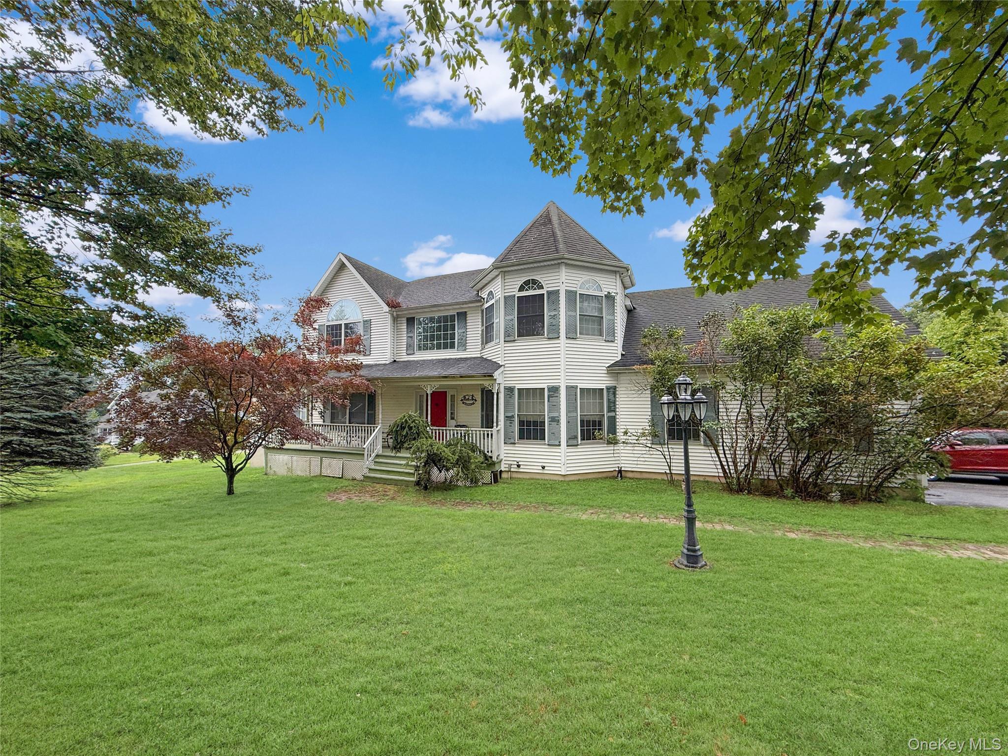 34 Feiertag Road Middletown, NY 10941 - Photo 2 of 28 Victorian-style house featuring a shingled roof and a front yard