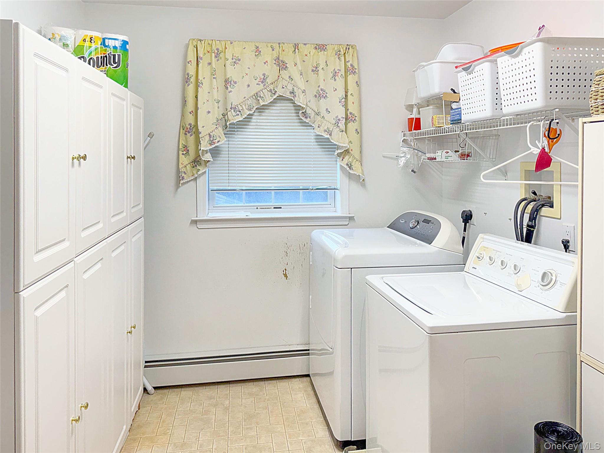 34 Feiertag Road Middletown, NY 10941 - Photo 28 of 28 Laundry room featuring cabinet space, independent washer and dryer, and baseboard heating