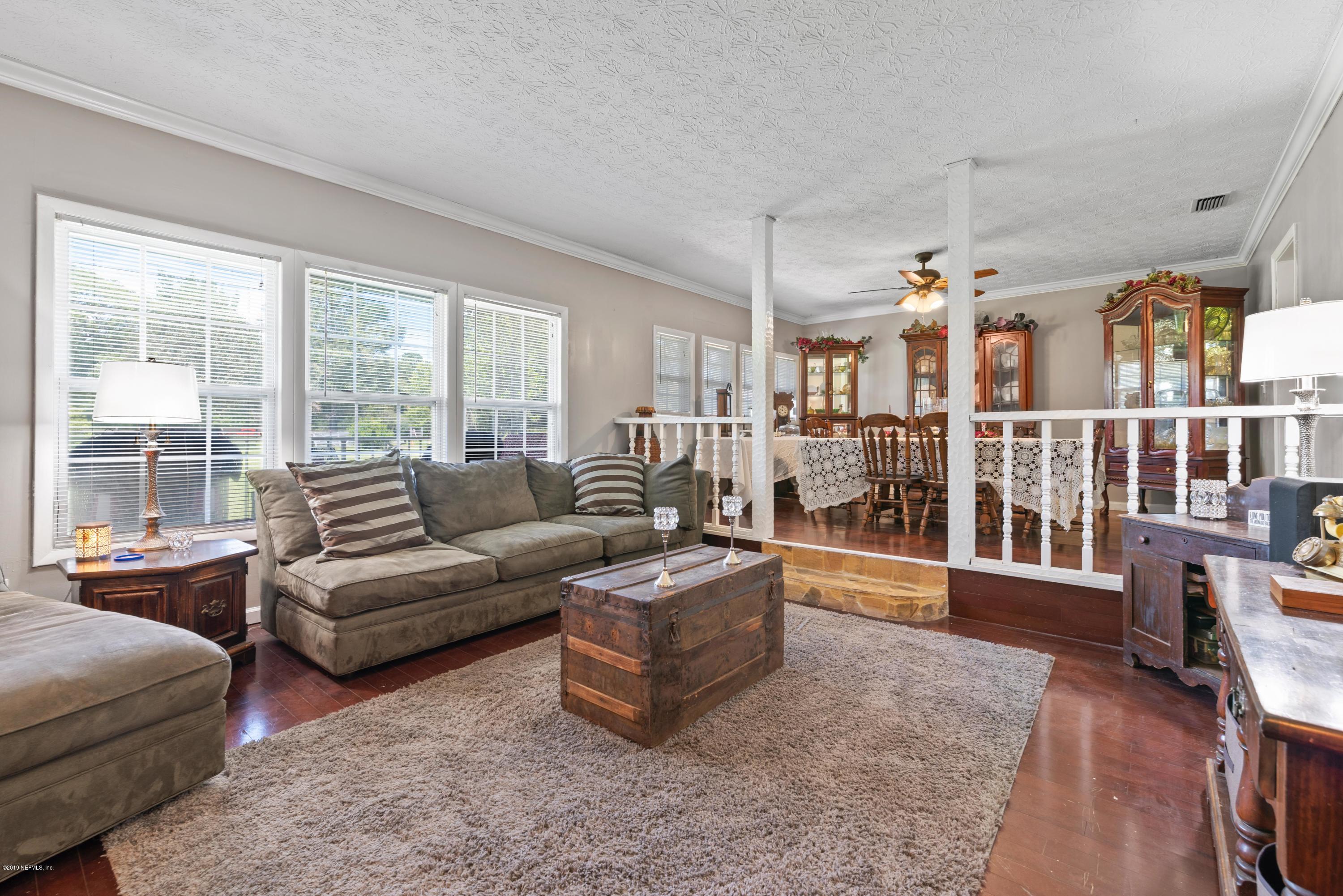 54152 Snyder Road Callahan, FL 32011 - Photo 11 of 39 a living room with furniture and a large window