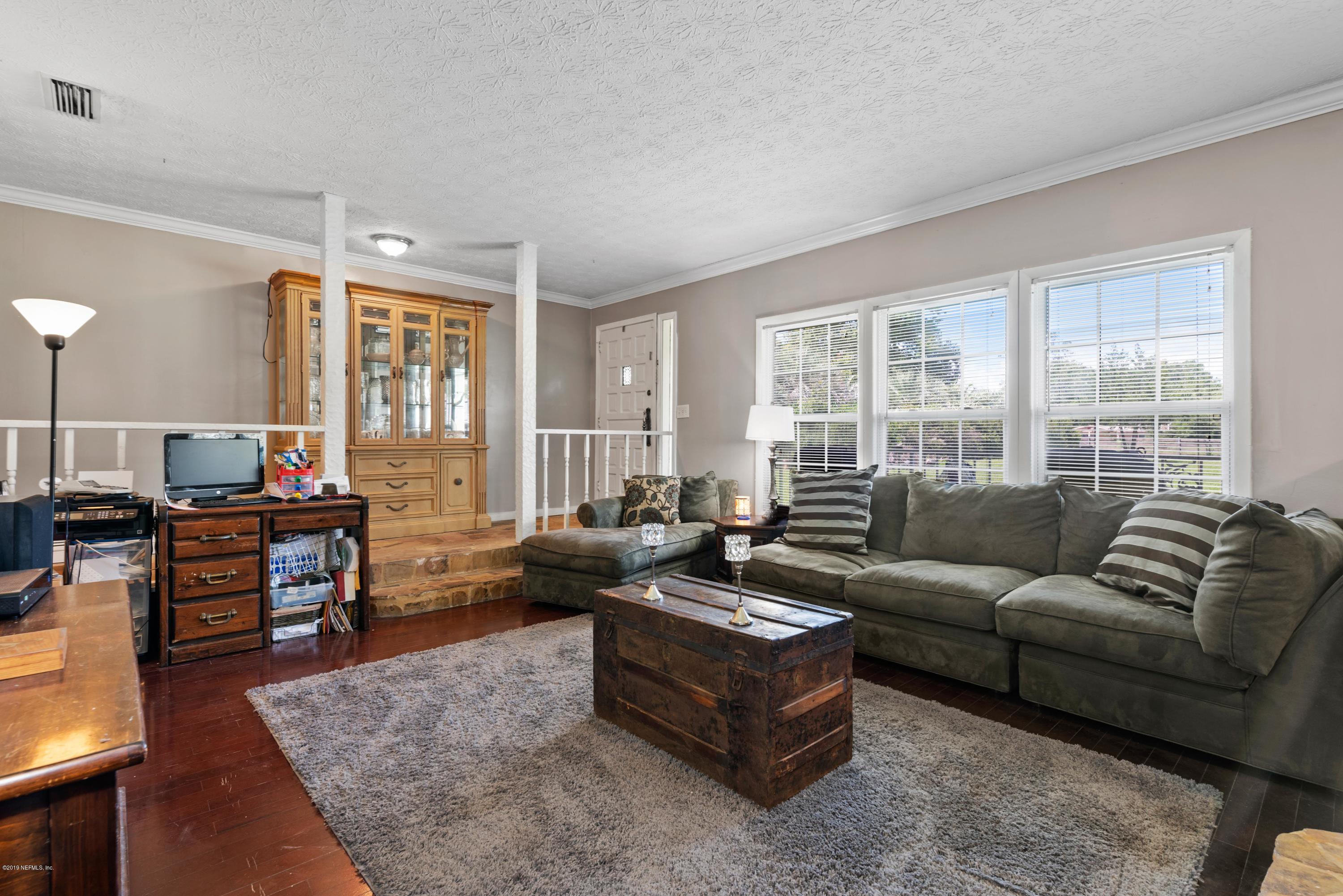 54152 Snyder Road Callahan, FL 32011 - Photo 12 of 39 a living room with furniture and a large window