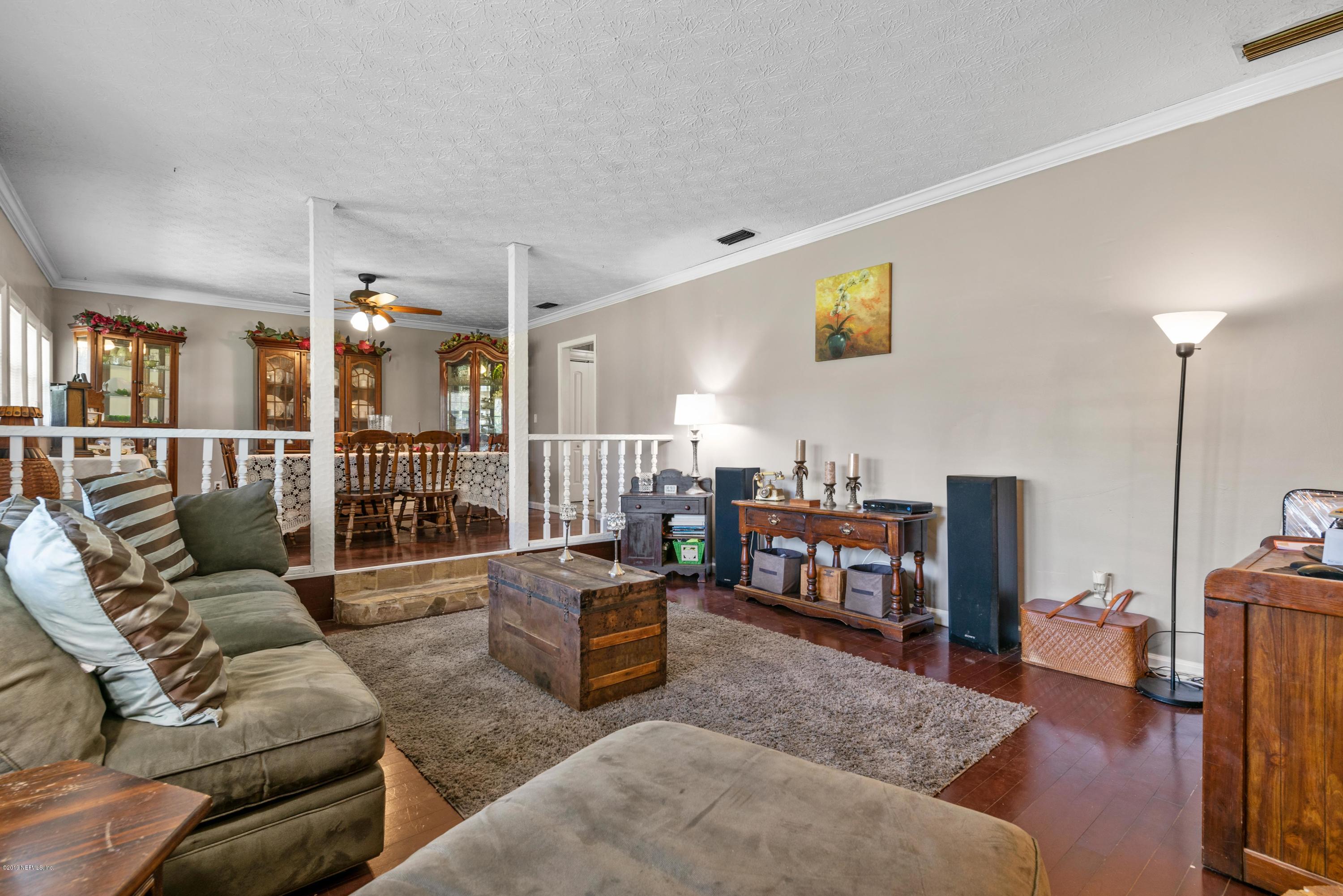 54152 Snyder Road Callahan, FL 32011 - Photo 13 of 39 a living room with furniture and a wooden floor