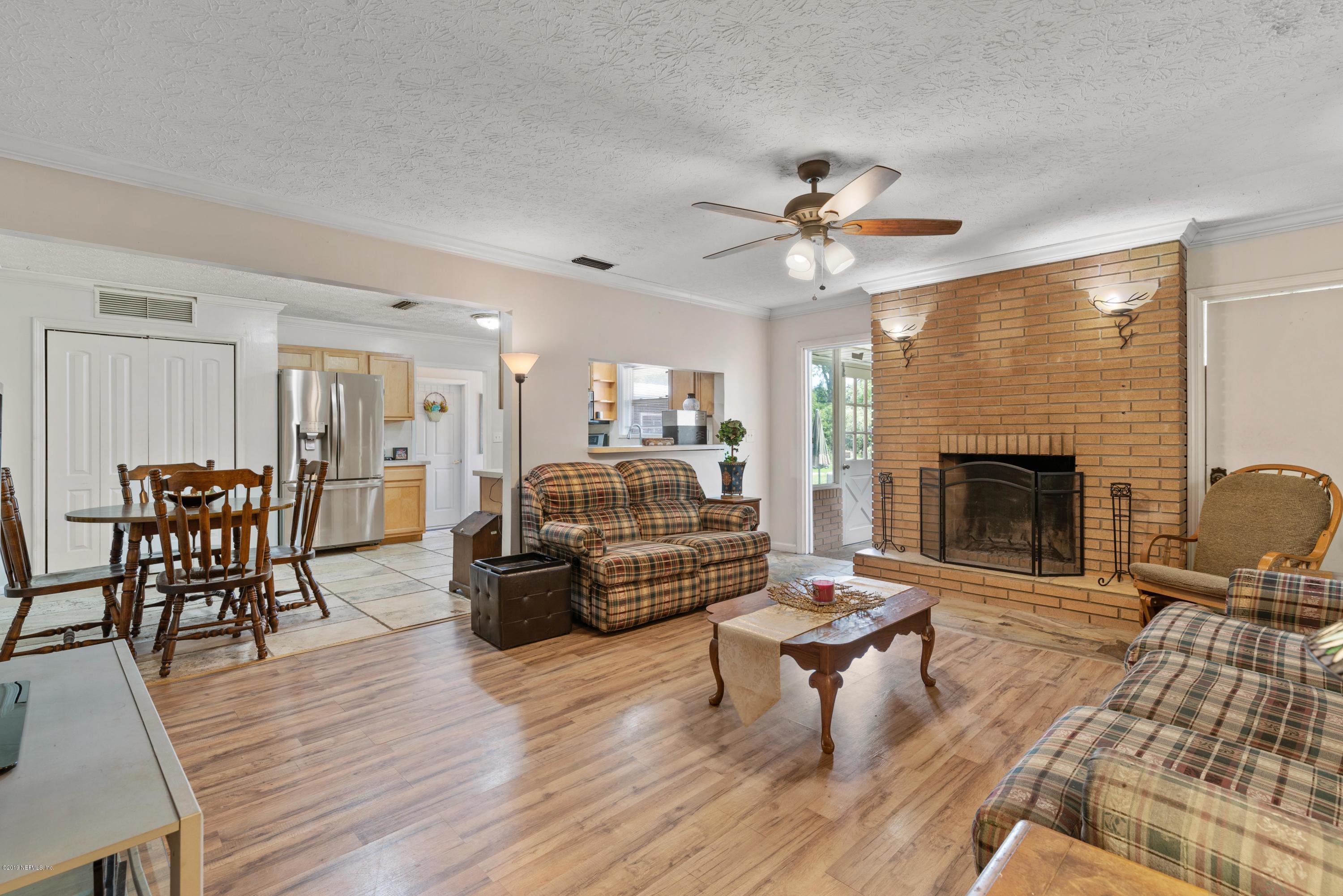 54152 Snyder Road Callahan, FL 32011 - Photo 20 of 39 a living room with furniture and a fireplace
