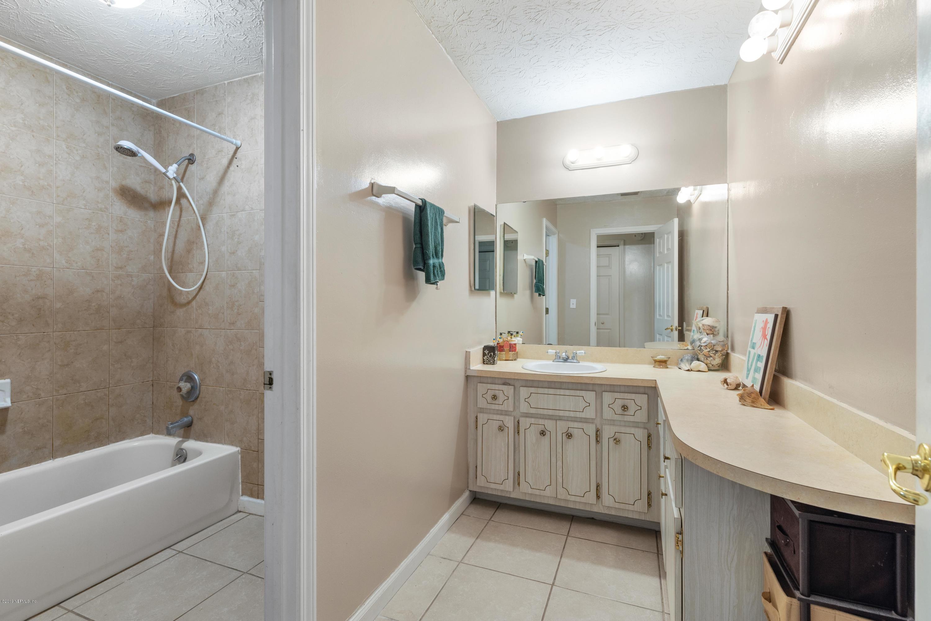 54152 Snyder Road Callahan, FL 32011 - Photo 27 of 39 a bathroom with a tub sink and mirror