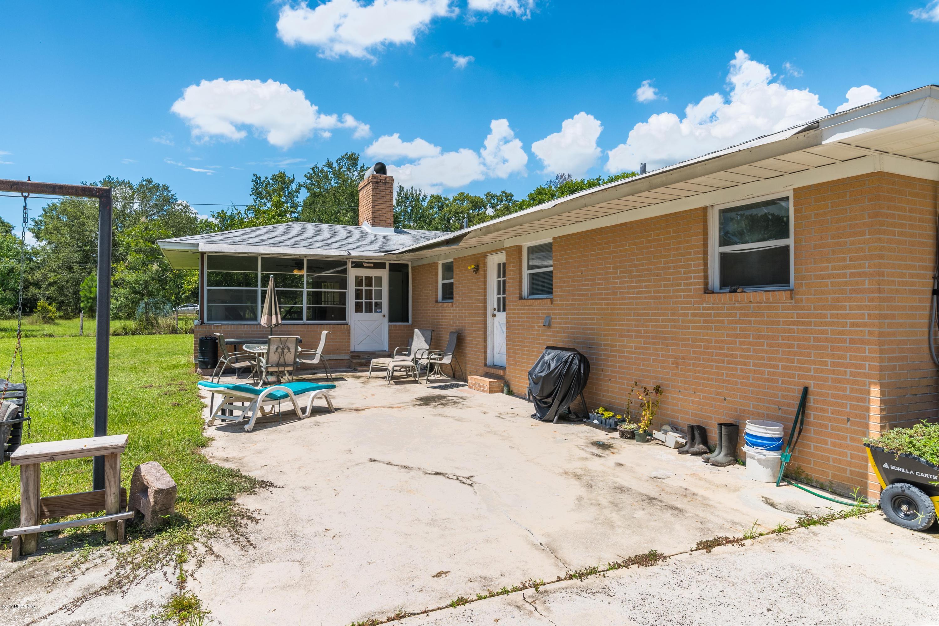 54152 Snyder Road Callahan, FL 32011 - Photo 30 of 39 a view of a house with backyard and sitting area