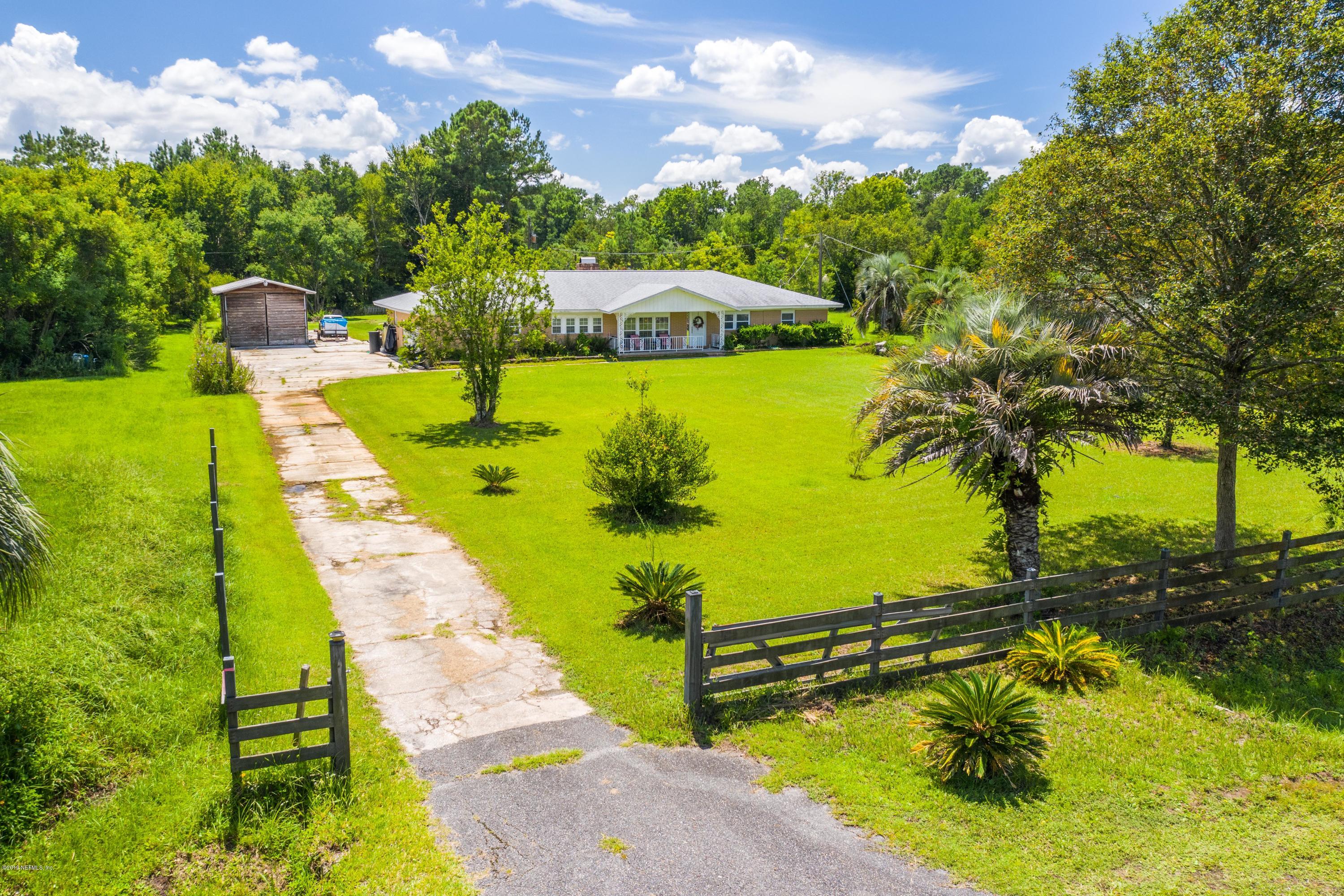 54152 Snyder Road Callahan, FL 32011 - Photo 3 of 39 a view of a swimming pool with a yard