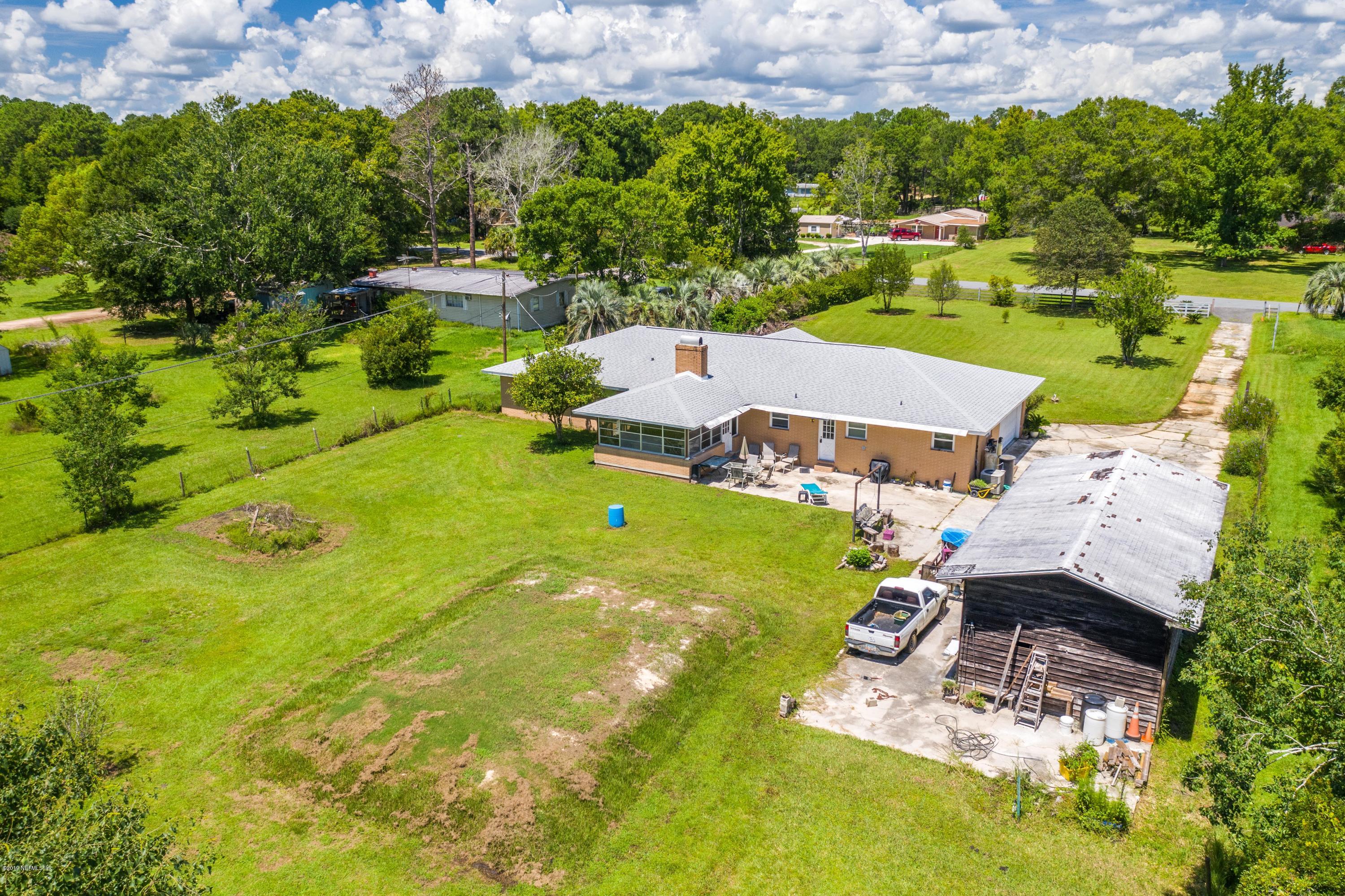 54152 Snyder Road Callahan, FL 32011 - Photo 38 of 39 an aerial view of a house with swimming pool and garden
