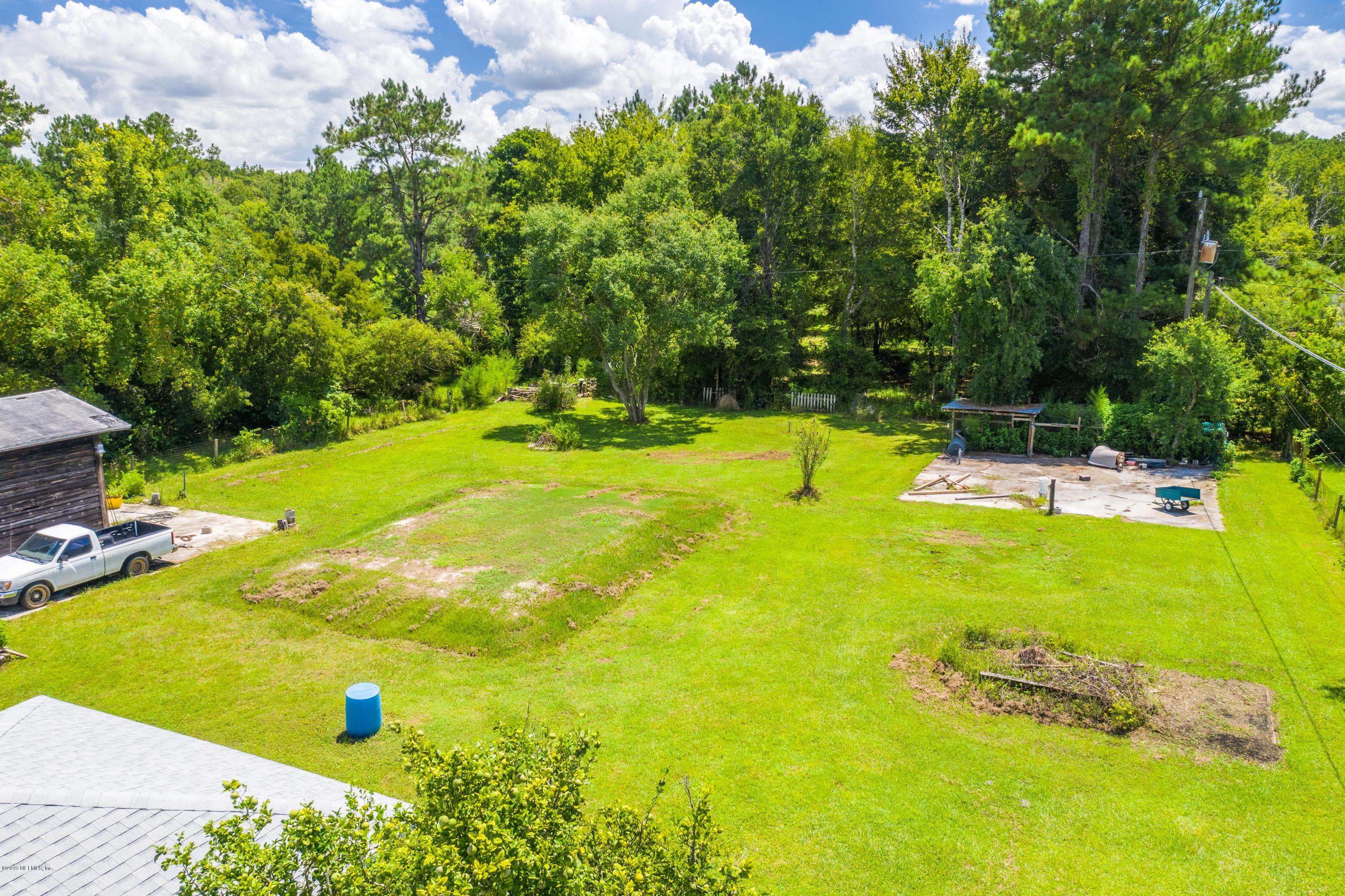 54152 Snyder Road Callahan, FL 32011 - Photo 39 of 39 a view of a swimming pool with a yard