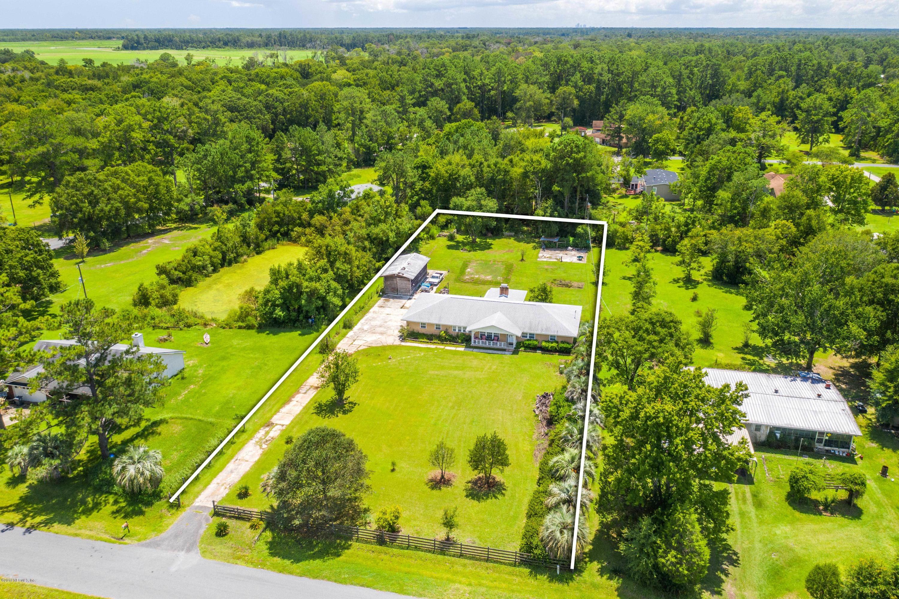54152 Snyder Road Callahan, FL 32011 - Photo 4 of 39 a view of a swimming pool with a yard
