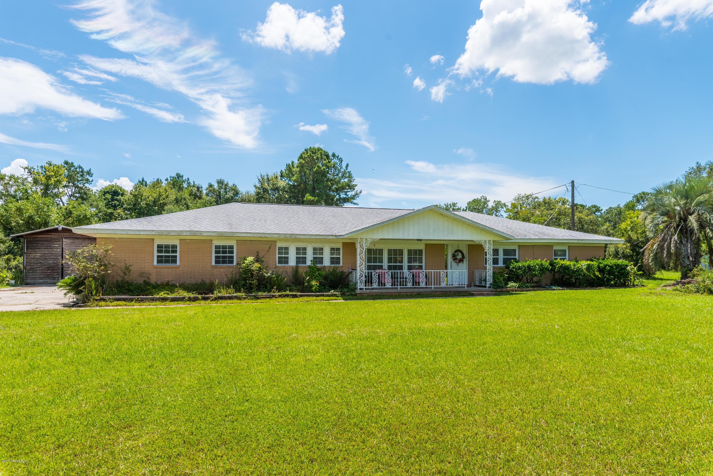 54152 Snyder Road Callahan, FL 32011 - Photo 7 of 39 a front view of a house with garden