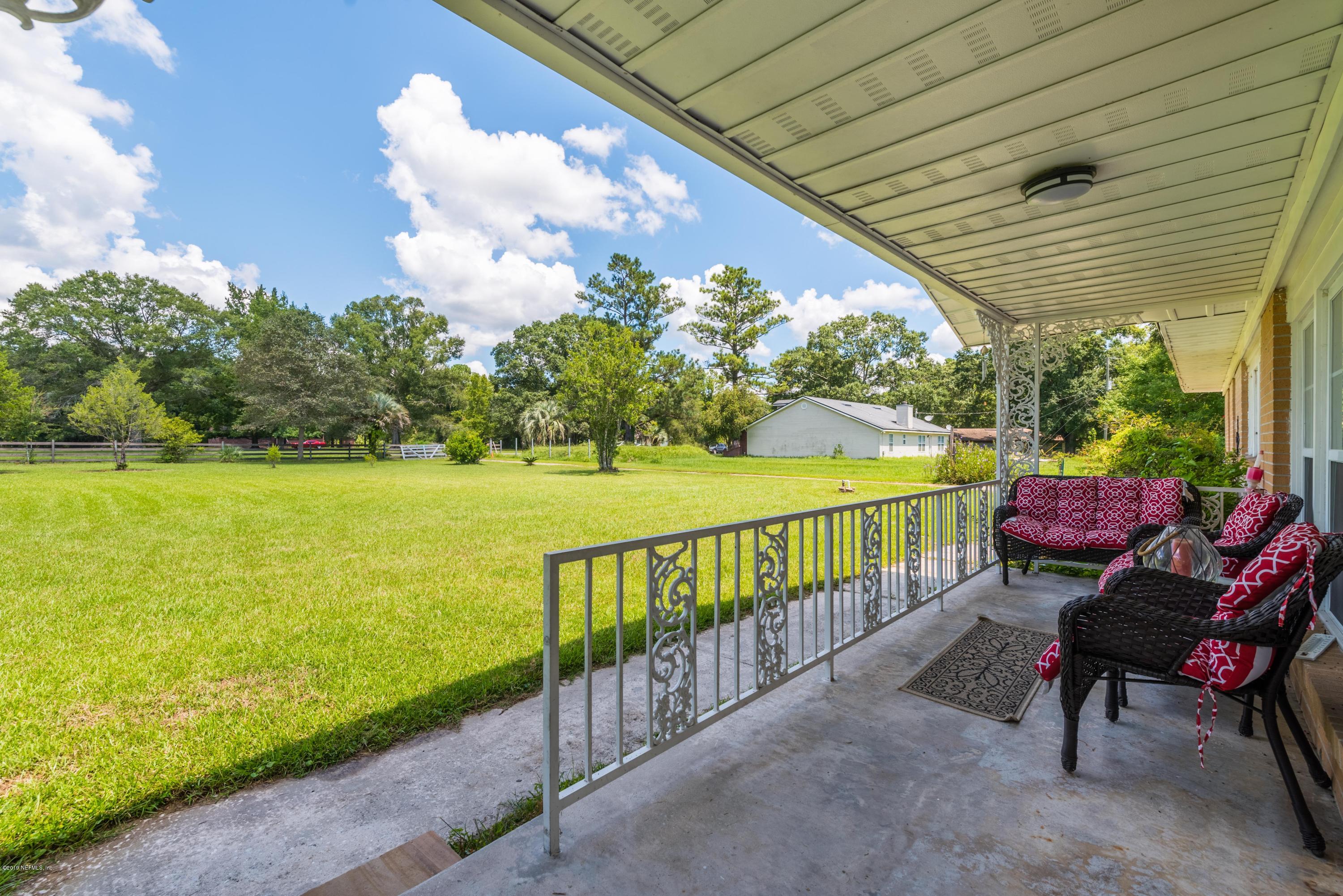 54152 Snyder Road Callahan, FL 32011 - Photo 9 of 39 a view of a patio with wooden floor