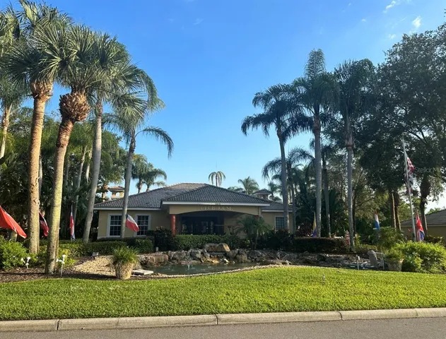 a view of house with yard and entertaining space