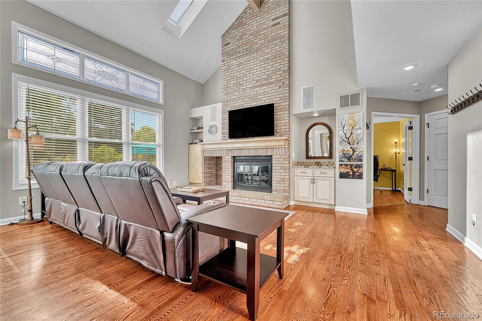6722 Eagle Place Highlands Ranch, CO 80130 - Photo 15 of 47 a living room with fireplace furniture and a flat screen tv