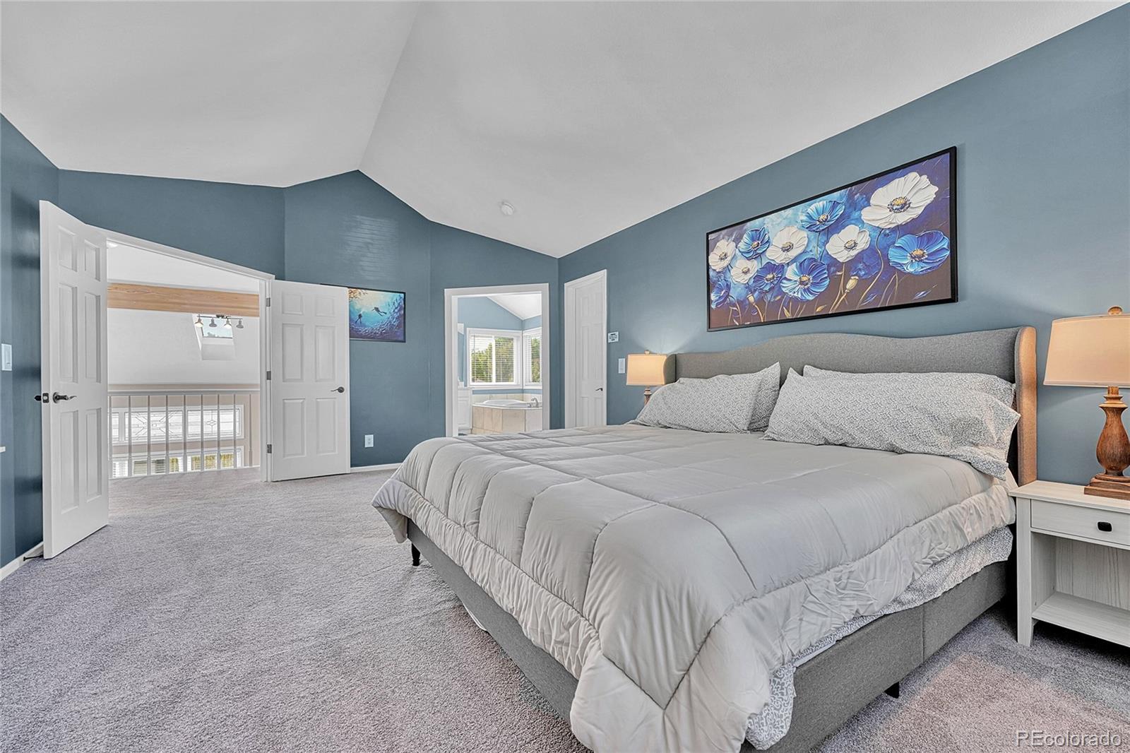 6722 Eagle Place Highlands Ranch, CO 80130 - Photo 22 of 47 a spacious bedroom with a large bed and a window