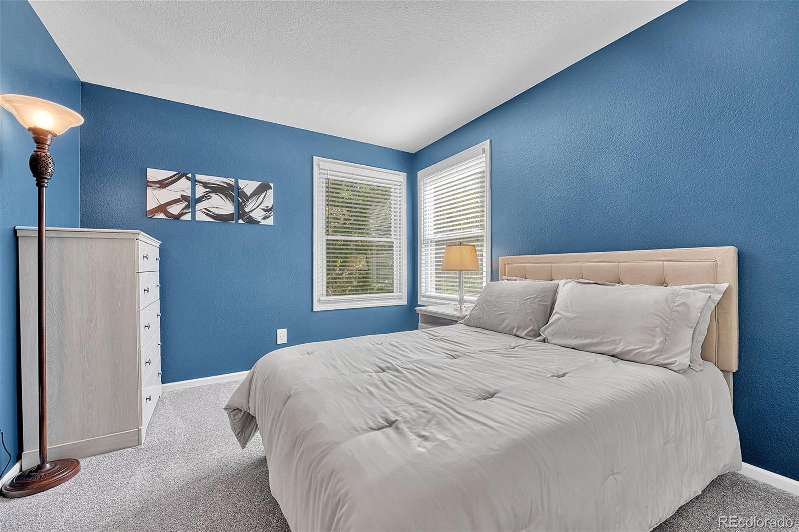 6722 Eagle Place Highlands Ranch, CO 80130 - Photo 25 of 47 a bedroom with a bed and a window
