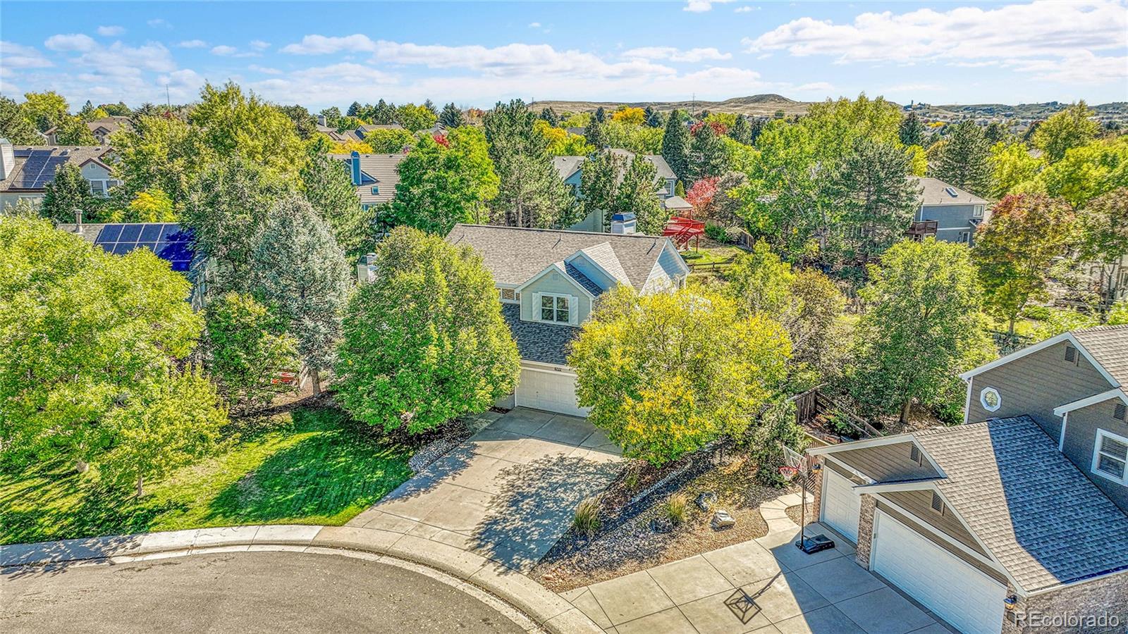 6722 Eagle Place Highlands Ranch, CO 80130 - Photo 35 of 47 a view of a garden with plants and large trees