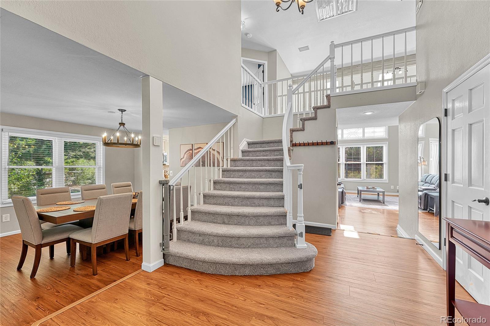 6722 Eagle Place Highlands Ranch, CO 80130 - Photo 6 of 47 a view of entryway and hall with wooden floor
