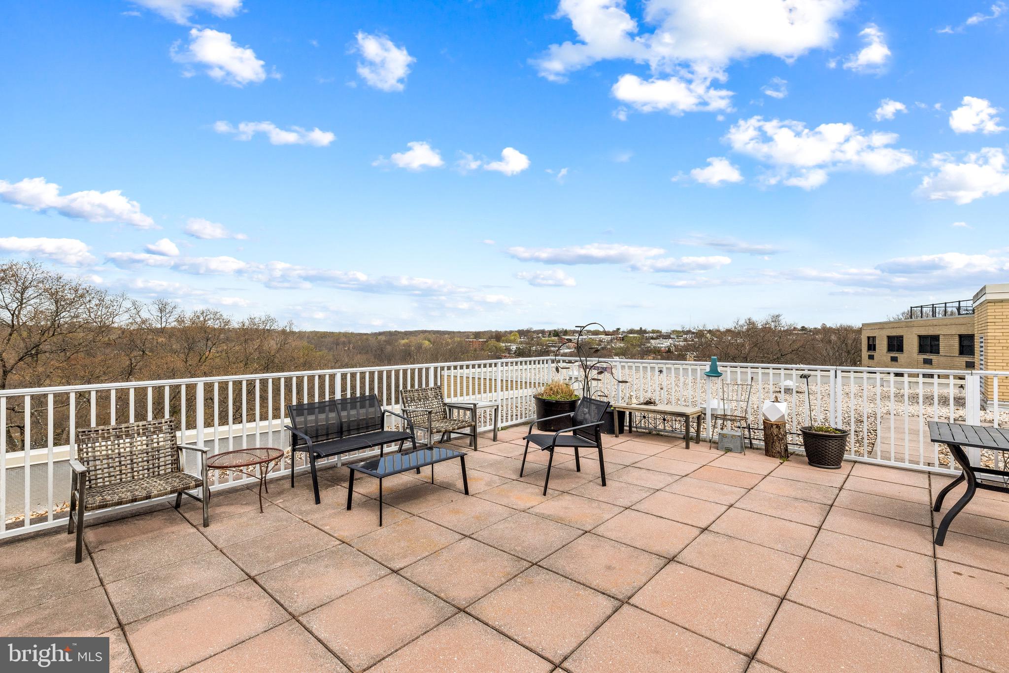 3025 Ontario Road Northwest, Unit 207 Washington, DC 20009 - Photo 14 of 15 a view of a terrace with furniture
