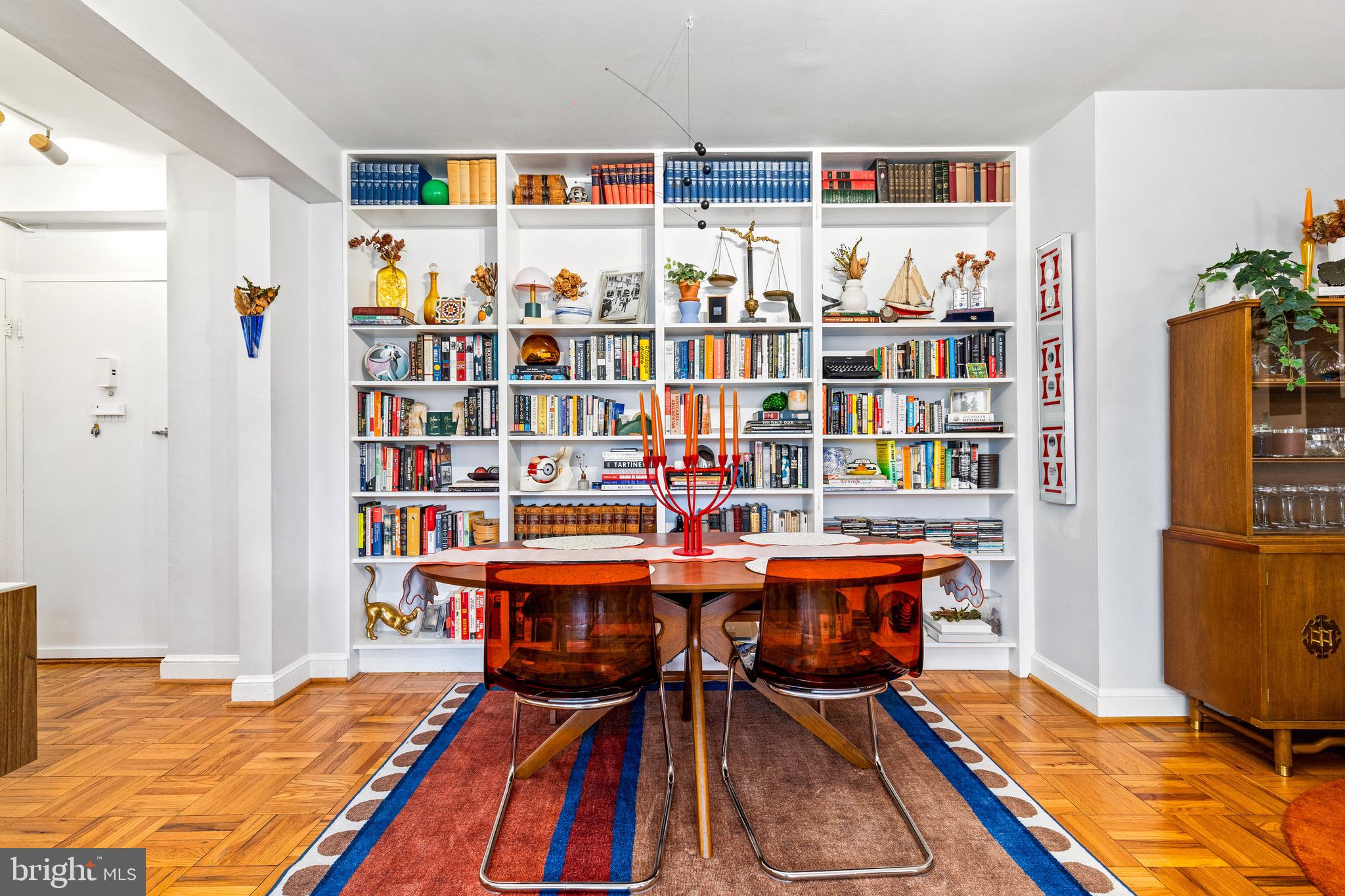 3025 Ontario Road Northwest, Unit 207 Washington, DC 20009 - Photo 6 of 15 a room with furniture and book shelf
