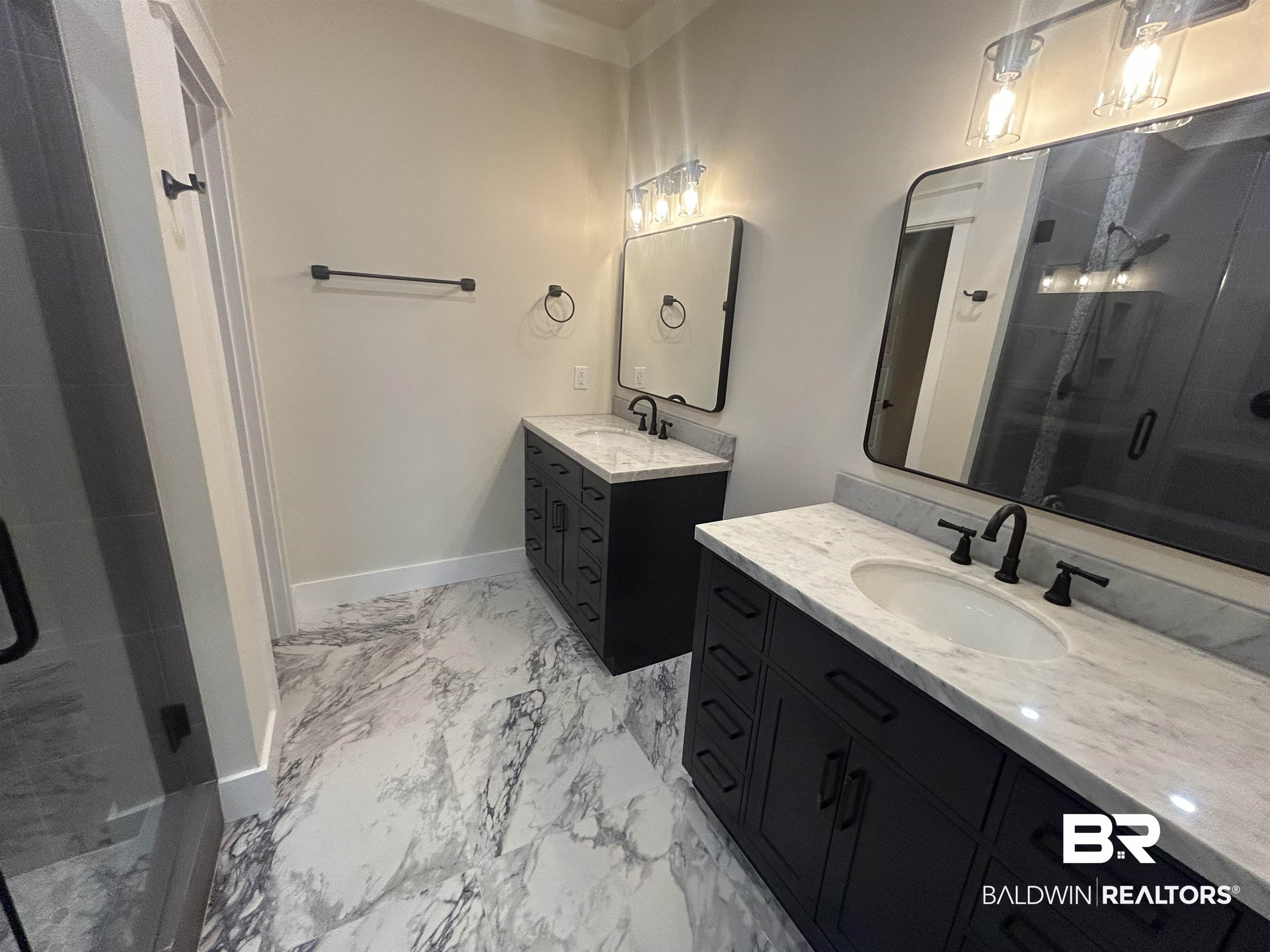 5122 Pine Road Orange Beach, AL 36561 - Photo 17 of 24 Full bath featuring a shower stall, two vanities, and light marble finish flooring