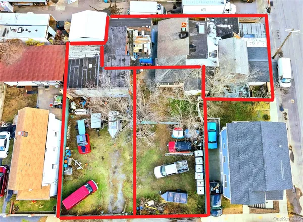 an aerial view of a ocean and trees