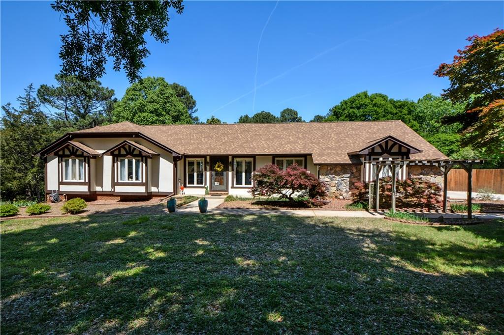 130 Hawn Road Fayetteville, GA 30215 - Photo 4 of 67 a front view of a house with garden