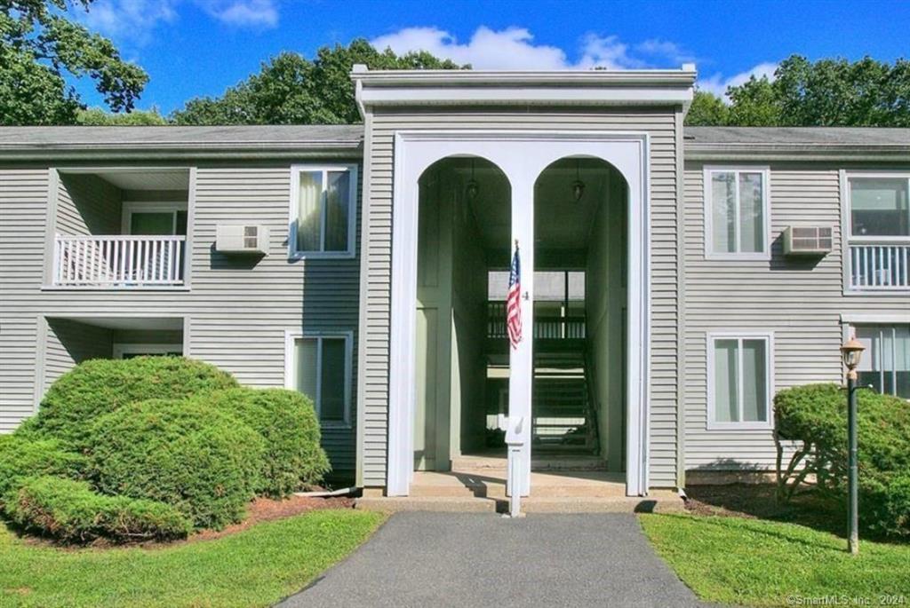 64 Nashville Road, Unit B Bethel, CT 06801 - Photo 1 of 1 a front view of a house with garden